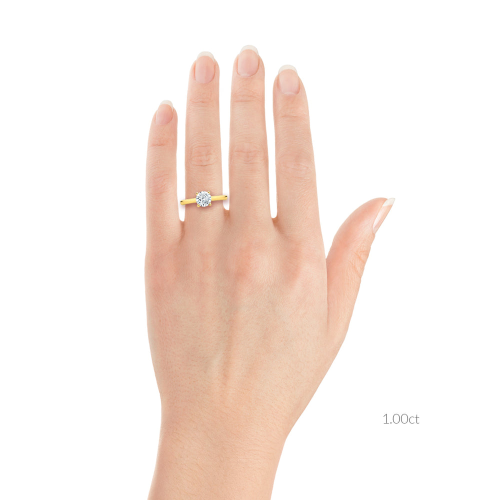 
                  
                    Bague de fiançailles Évangéline en or jaune 18 carats à diamant solitaire ornée d'un diamant de laboratoire de taille rond
                  
                