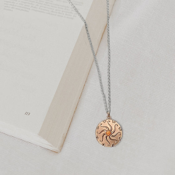 Sunrise pendant in gold and silver